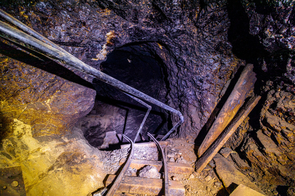 Broken train tracks inside an old and abandoned gold mine in Cal