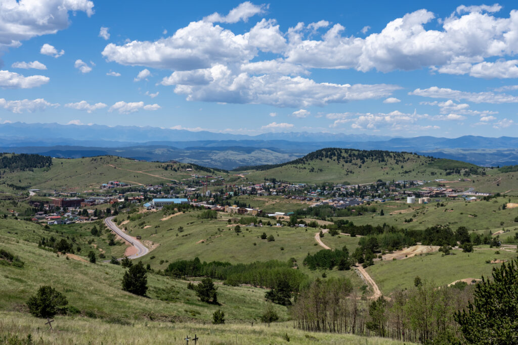 looking down onto the town of Cripple Creek, Colorado and the surrounding mountains